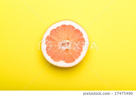grapefruit with yellow background grapefruit with yellow background 27475490