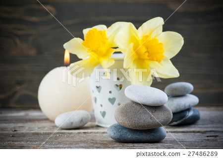 Balancing pebble stones and yellow flowers Balancing pebble stones and yellow flowers 27486289