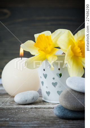 Balancing pebble stones and yellow flowers Balancing pebble stones and yellow flowers 27486290