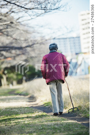 Senior woman using walking stick 27486366