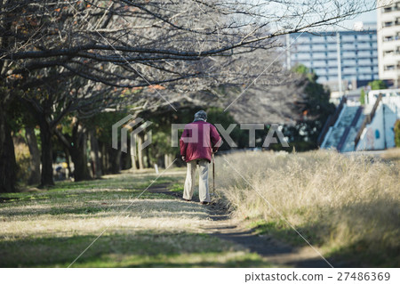 Senior woman using walking stick Senior woman using walking stick 27486369