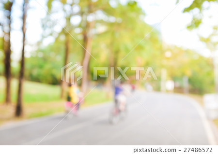 Blurred background of people activities in park 27486572