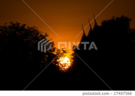 sunset with thai temple and tree silhouette 27487566