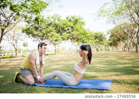 Doing sit-ups Doing sit-ups 27488556