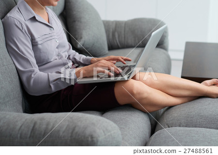 Working on laptop Working on laptop 27488561