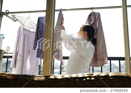 Women living alone living the elderly laundry Women living alone living the elderly laundry 27488936