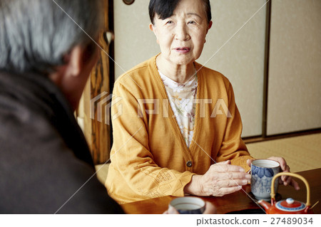 Two people living a crowded old elderly crowd 27489034