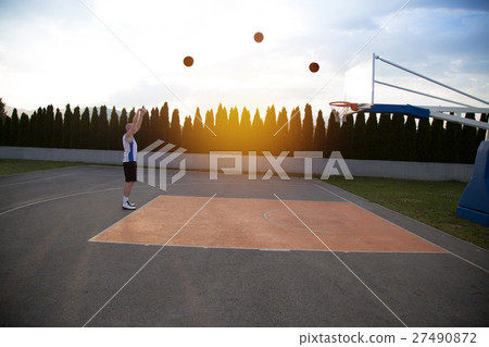 A man, standing tall, preparing to shoot a A man, standing tall, preparing to shoot a 27490872
