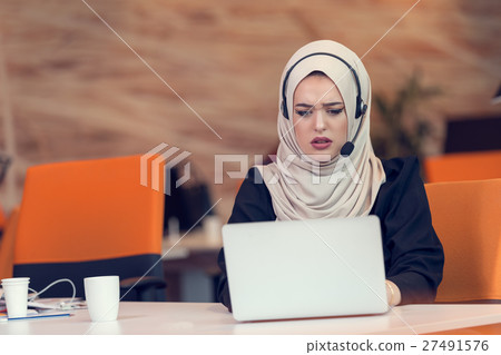Young Arabic business woman wearing hijab,working 27491576
