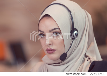 Beautiful phone operator arab woman working in Beautiful phone operator arab woman working in 27491746