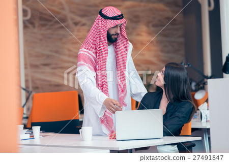 Multi ethnic business people at work in modern Multi ethnic business people at work in modern 27491847