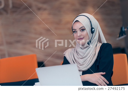 Beautiful phone operator arab woman working in 27492175