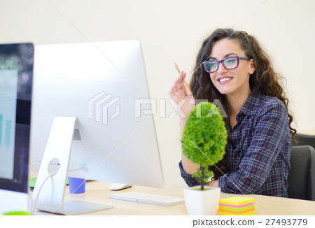 Portrait of businesswoman with computer writes on Portrait of businesswoman with computer writes on 27493779