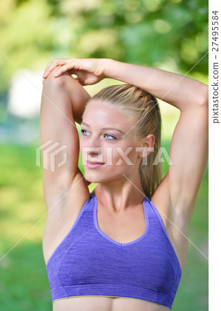 Young girl stretching outdoors. Jogging - workout Young girl stretching outdoors. Jogging - workout 27495584
