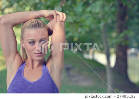 Young girl stretching outdoors. Jogging - workout Young girl stretching outdoors. Jogging - workout 27496182