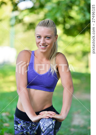 Young girl stretching outdoors. Jogging - workout Young girl stretching outdoors. Jogging - workout 27496185