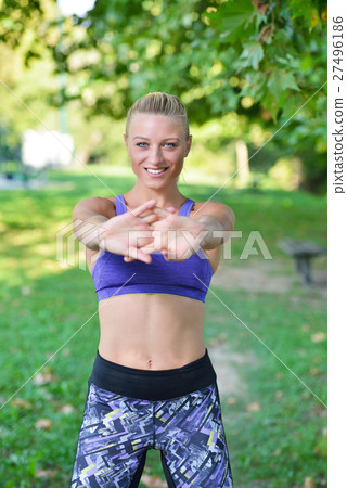 Young girl stretching outdoors. Jogging - workout Young girl stretching outdoors. Jogging - workout 27496186