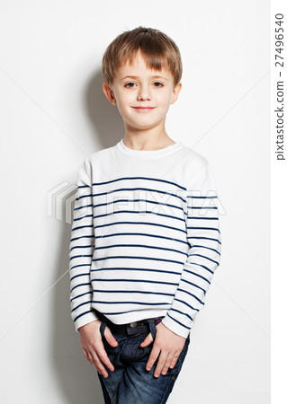 图库照片: cute little boy standing on background