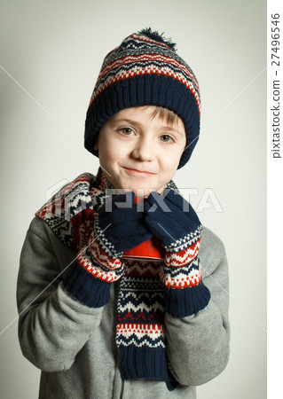 Happy child wearing a woolen hat Happy child wearing a woolen hat 27496546