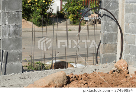 Brick fence building with electric wire line Brick fence building with electric wire line 27499884