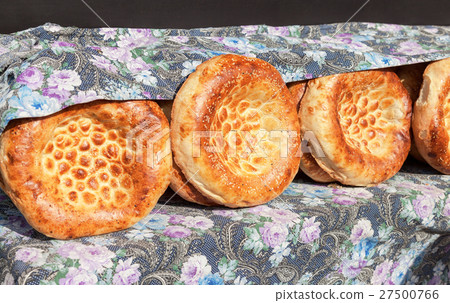 Traditional uzbek flatbread with sesame seeds Traditional uzbek flatbread with sesame seeds 27500766