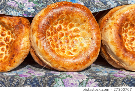 Traditional uzbek flatbread with sesame seeds Traditional uzbek flatbread with sesame seeds 27500767