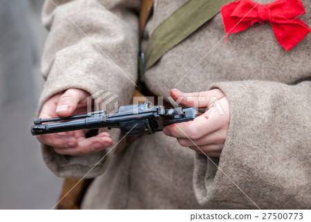 Revolver system Nagant in bloodied hands soldier  27500773