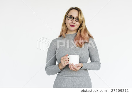 Woman in grey dress holding a cup 27509211