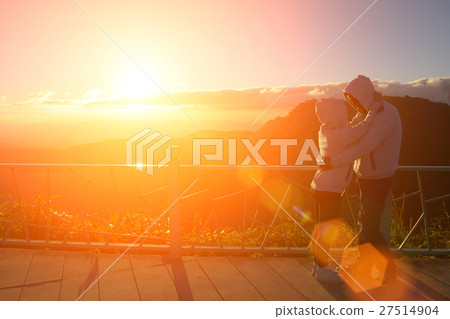 Silhouette of couples happy at scenic mountain fog Silhouette of couples happy at scenic mountain fog 27514904