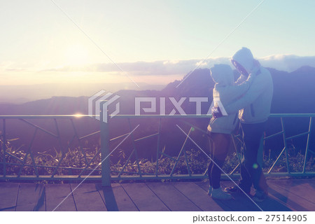 Silhouette of couples happy at scenic mountain fog 27514905
