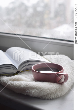 Cozy home still life: cup of hot coffee and opened 27515595