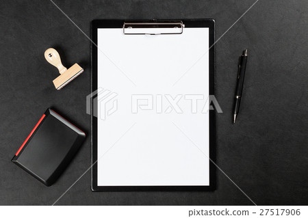Black clipboard on a table 27517906