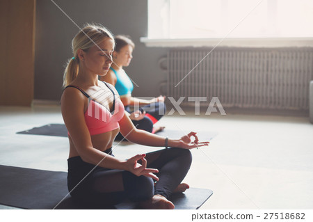 Young women in yoga class, relax meditation pose 27518682