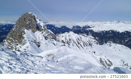 Alpine snowy mountain peaks panorama skiing piste 27521603