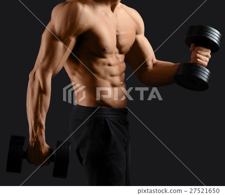 Male bodybuilder posing in studio Male bodybuilder posing in studio 27521650