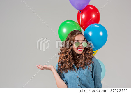 girl with sunglasses and bunch of colorful 27522551