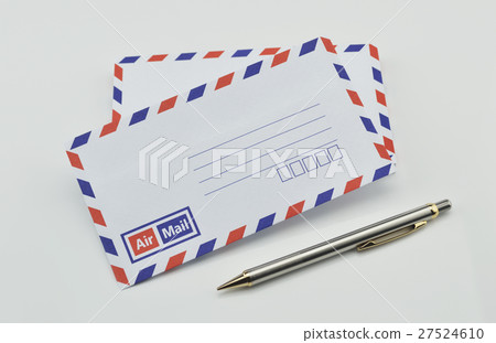 Stack of air mail envelopes and pen on white Stack of air mail envelopes and pen on white 27524610