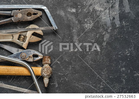 Set of tools on dark cement background Set of tools on dark cement background 27532663