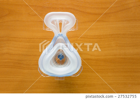 CPAP mask on wood table 27532755