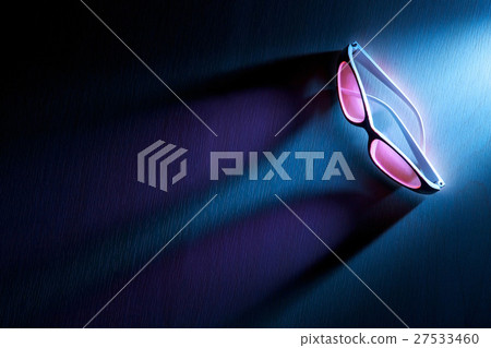 sunglasses with dramatic lighting and long shadow 27533460