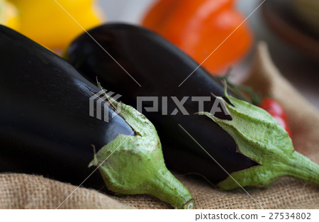 Fresh eggplant on the old wooden table 27534802
