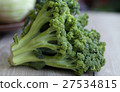Bunch of fresh green broccoli on wooden background 27534815