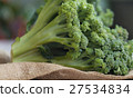 Bunch of fresh green broccoli on wooden background 27534834