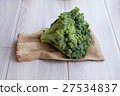 Bunch of fresh green broccoli on wooden background 27534837