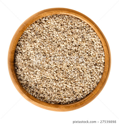 Natural white sesame seeds in wooden bowl over whi 27539898