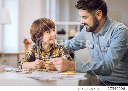 Happy smiling boy looking at his father Happy smiling boy looking at his father 27540906