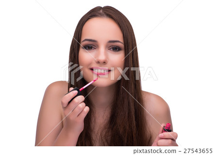 Woman doing makeup isolated on white Woman doing makeup isolated on white 27543655