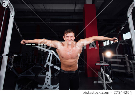big strong bodybuider without shirts demonstrate 27544294