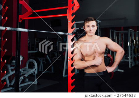 portrait of a handsome athlete at gym. man does portrait of a handsome athlete at gym. man does 27544638