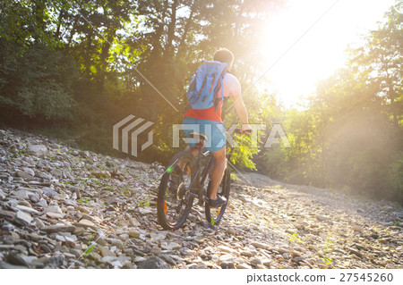 Young man with backpack on the bicycle Young man with backpack on the bicycle 27545260
